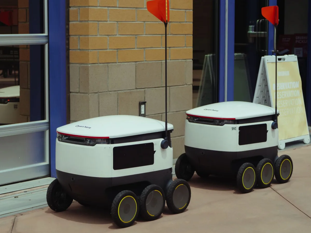 delivery robots outside building ready for modern food service.