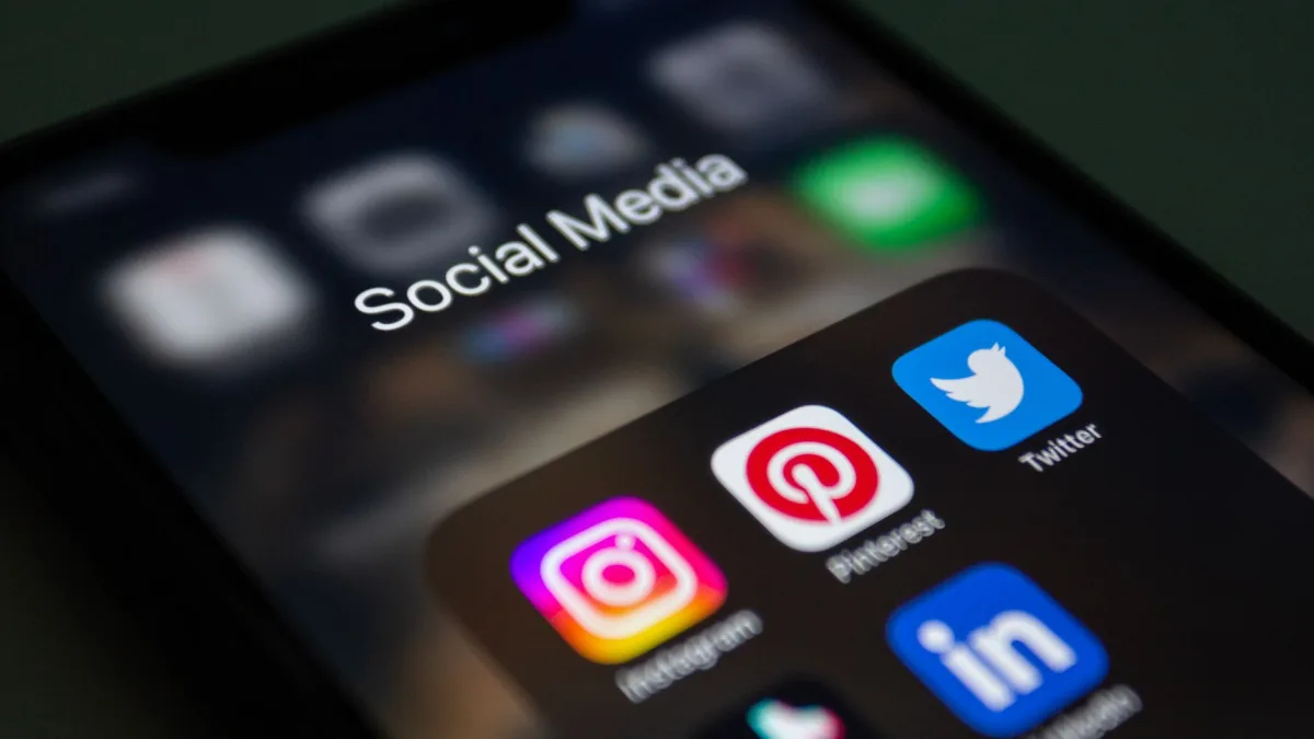 A smartphone screen displaying social media applications like Instagram and Twitter. A smartphone screen displaying social media applications like Instagram and Twitter.