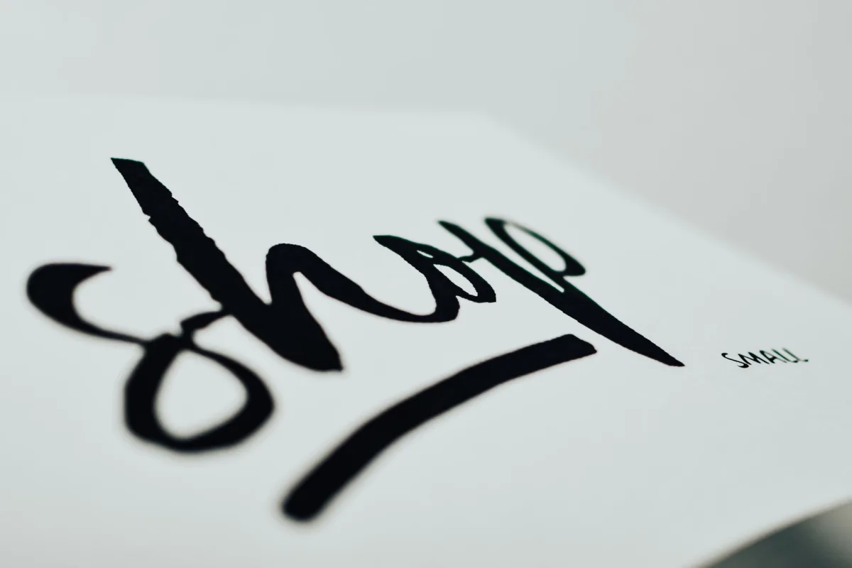 Close-up of a handwritten sign promoting small businesses.