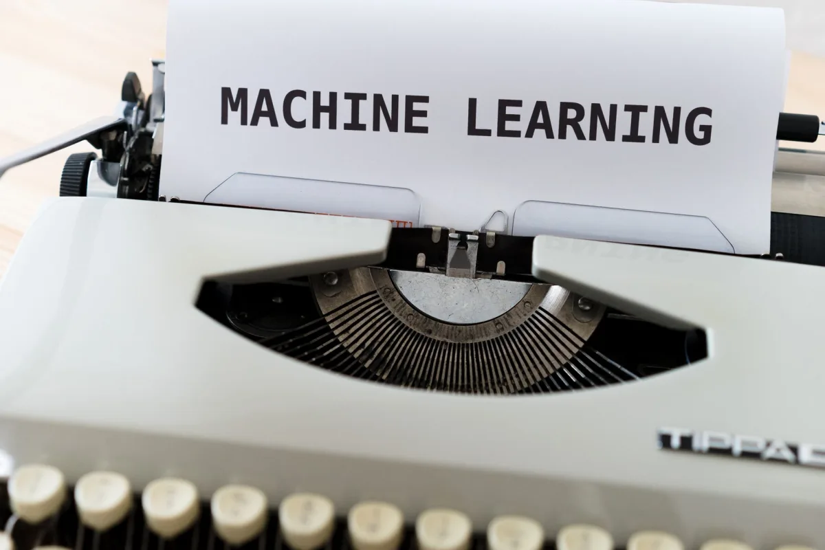 Vintage typewriter displaying 'Machine Learning' text, blending old new concepts. Vintage typewriter displaying 'Machine Learning' text, blending old new concepts.