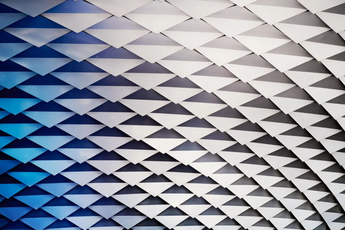 Abstract geometric ceiling with white structures and blue gradient lighting. Abstract geometric ceiling with white structures and blue gradient lighting.