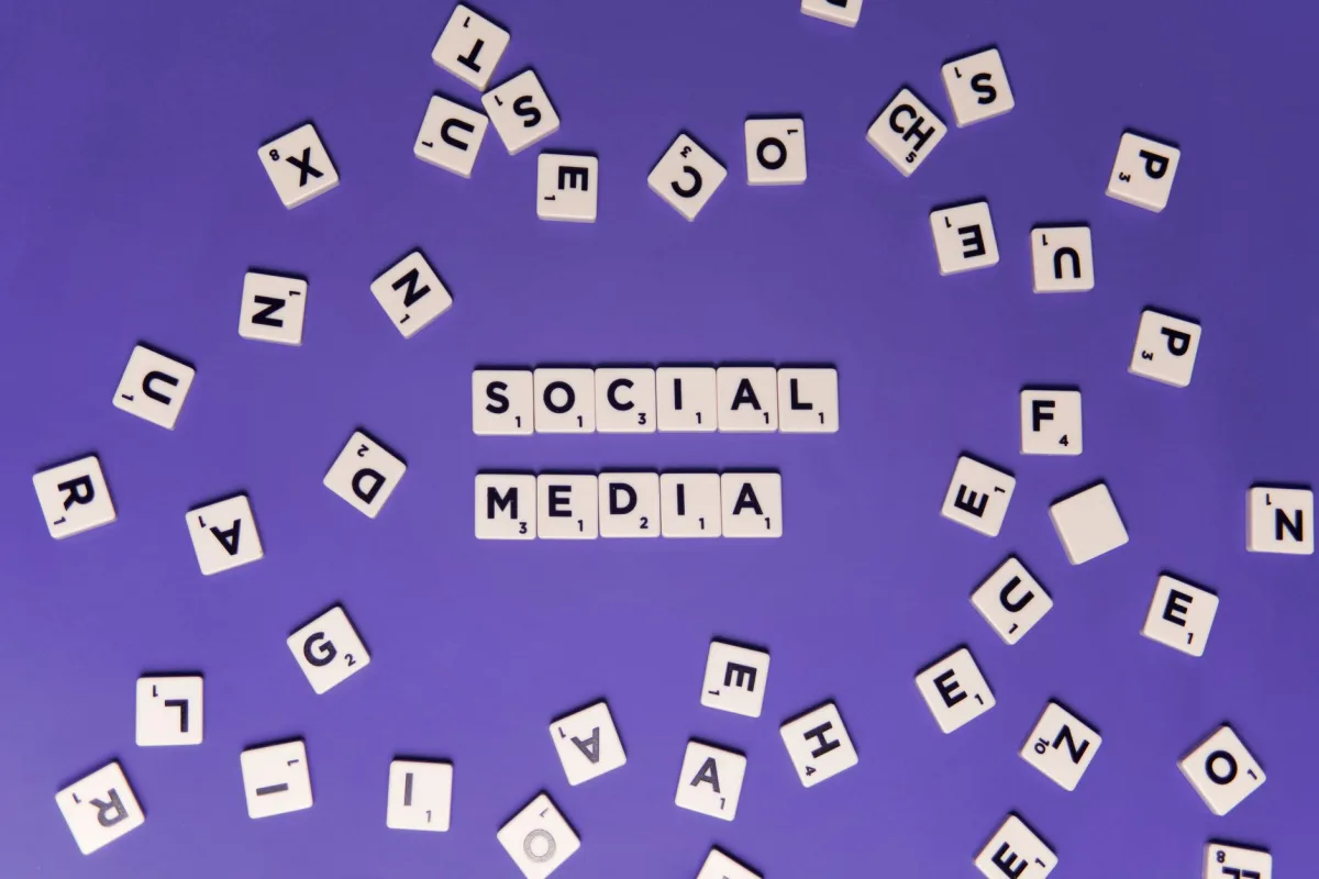 Creative composition of scrabble tiles spelling 'Social Media' on a purple background. Creative composition of scrabble tiles spelling 'Social Media' on a purple background.