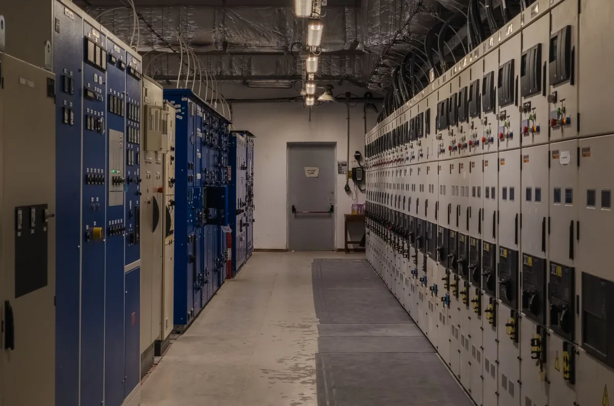 A sophisticated control room filled with electrical panels and equipment industrial purposes. A sophisticated control room filled with electrical panels and equipment industrial purposes.