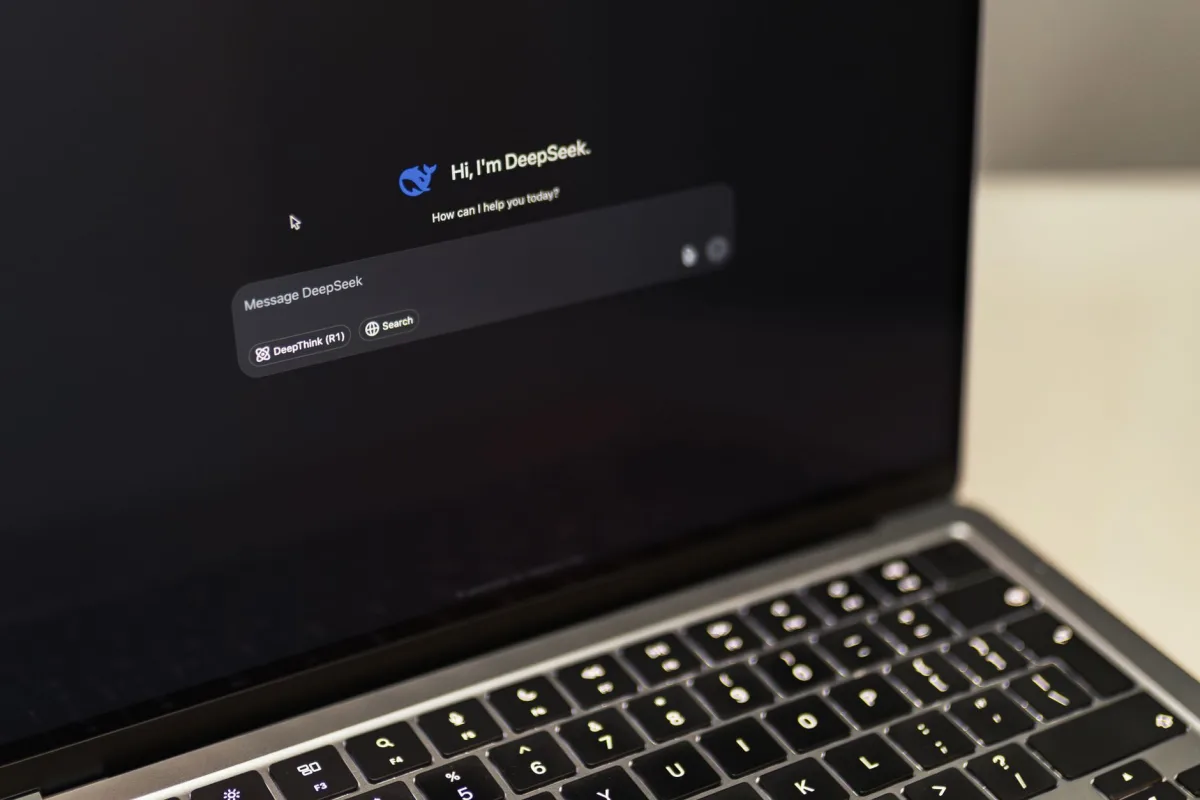A MacBook displaying the DeepSeek AI interface, showcasing innovation.