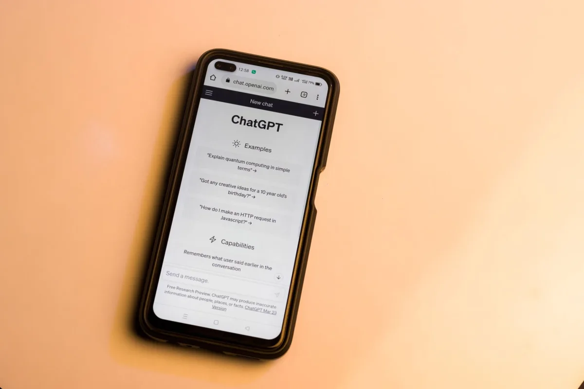 Smartphone showing website with warm tone, highlighting AI technology.
