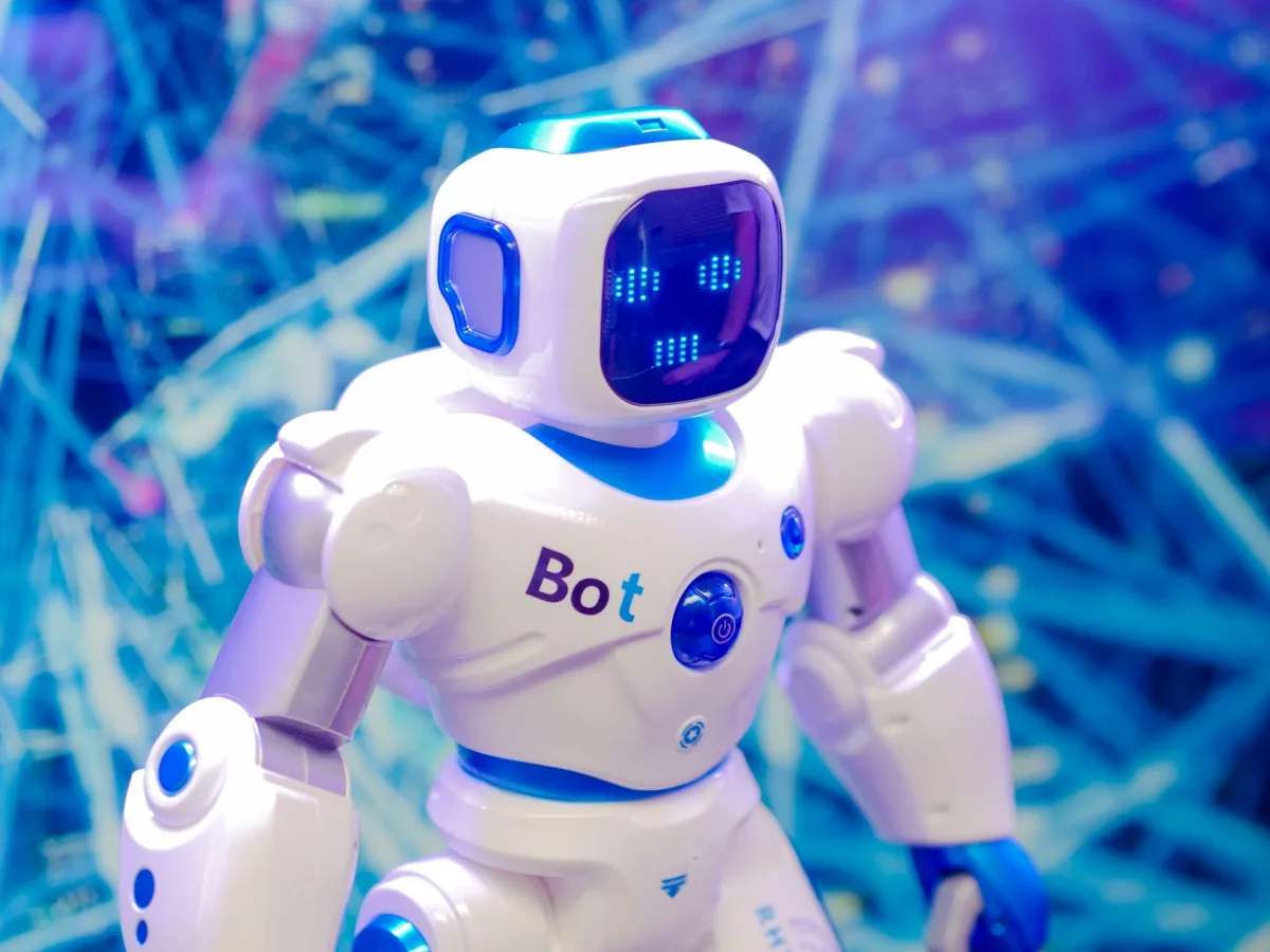 High-tech humanoid robot with LED face display, showcasing robotics and innovation.