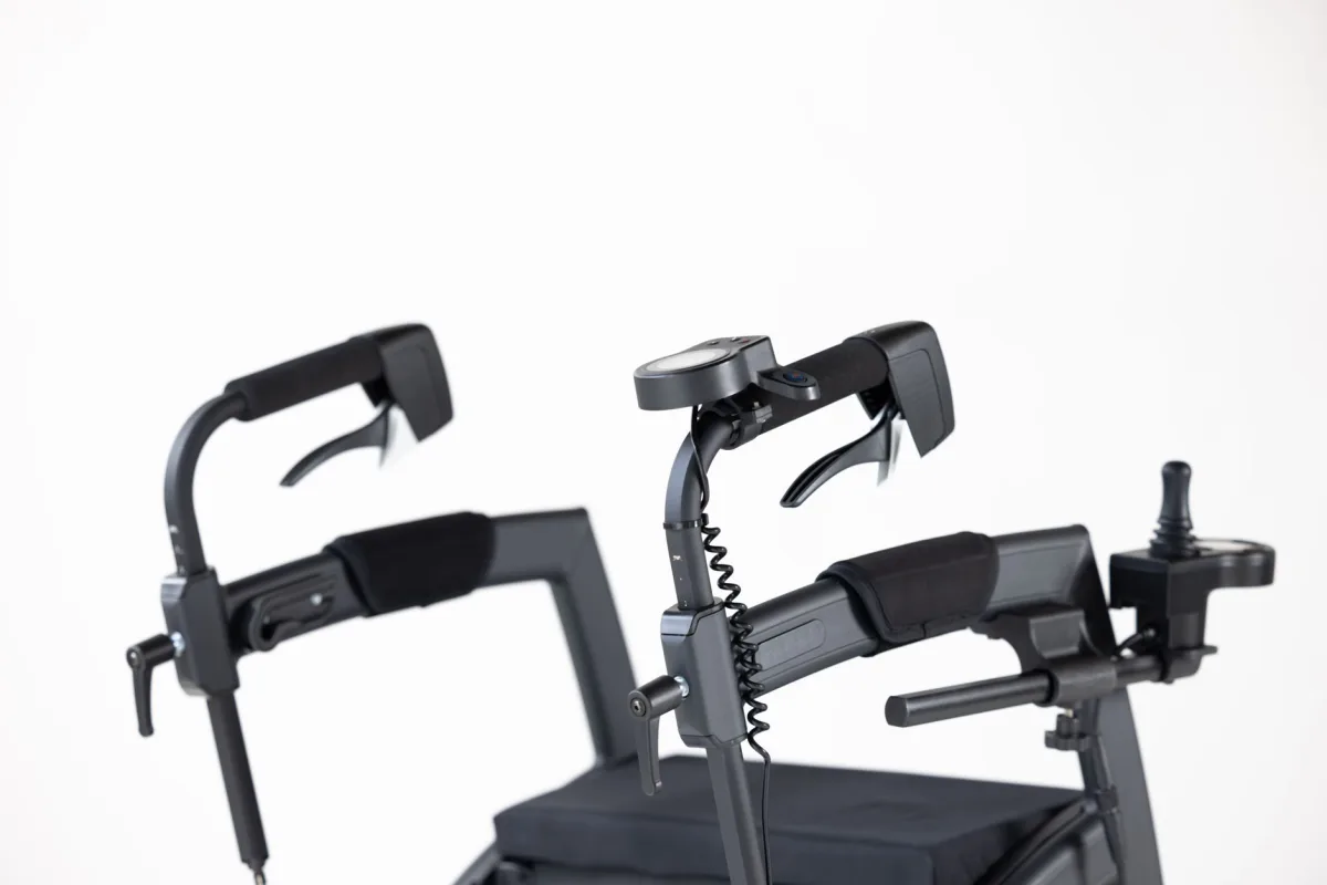 Detailed view of electric wheelchair controls with white background.