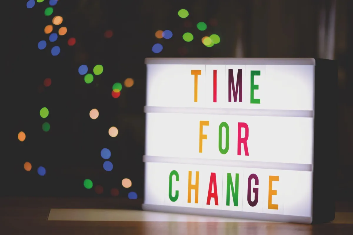 Colorful illuminated sign displaying motivational message 'Time for Change'. Colorful illuminated sign displaying motivational message 'Time for Change'.