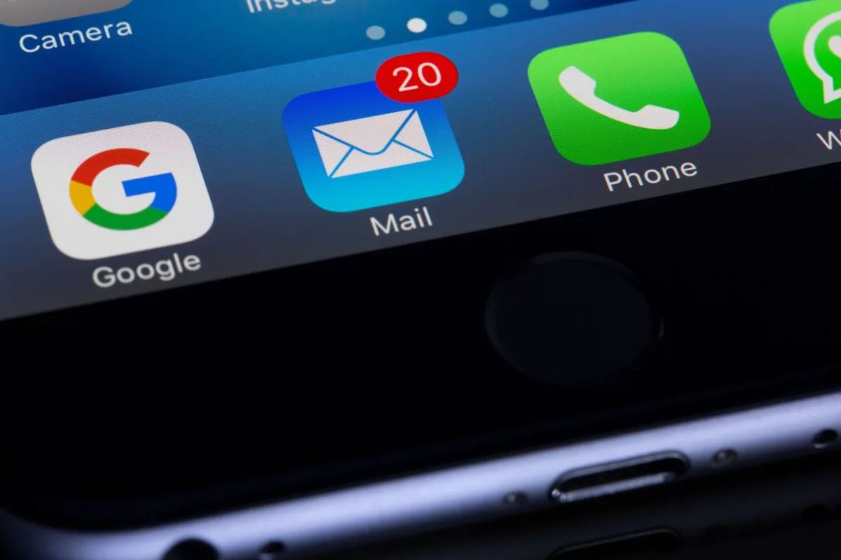 A close-up photo of a smartphone displaying popular apps like Google and Mail. A close-up photo of a smartphone displaying popular apps like Google and Mail.