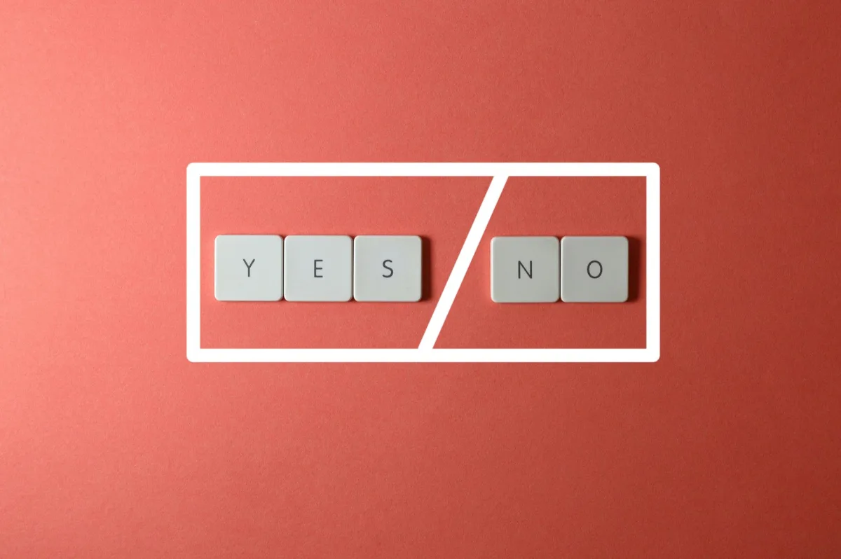 Creative concept of decision making with YES and NO keys on a red background. Creative concept of decision making with YES and NO keys on a red background.