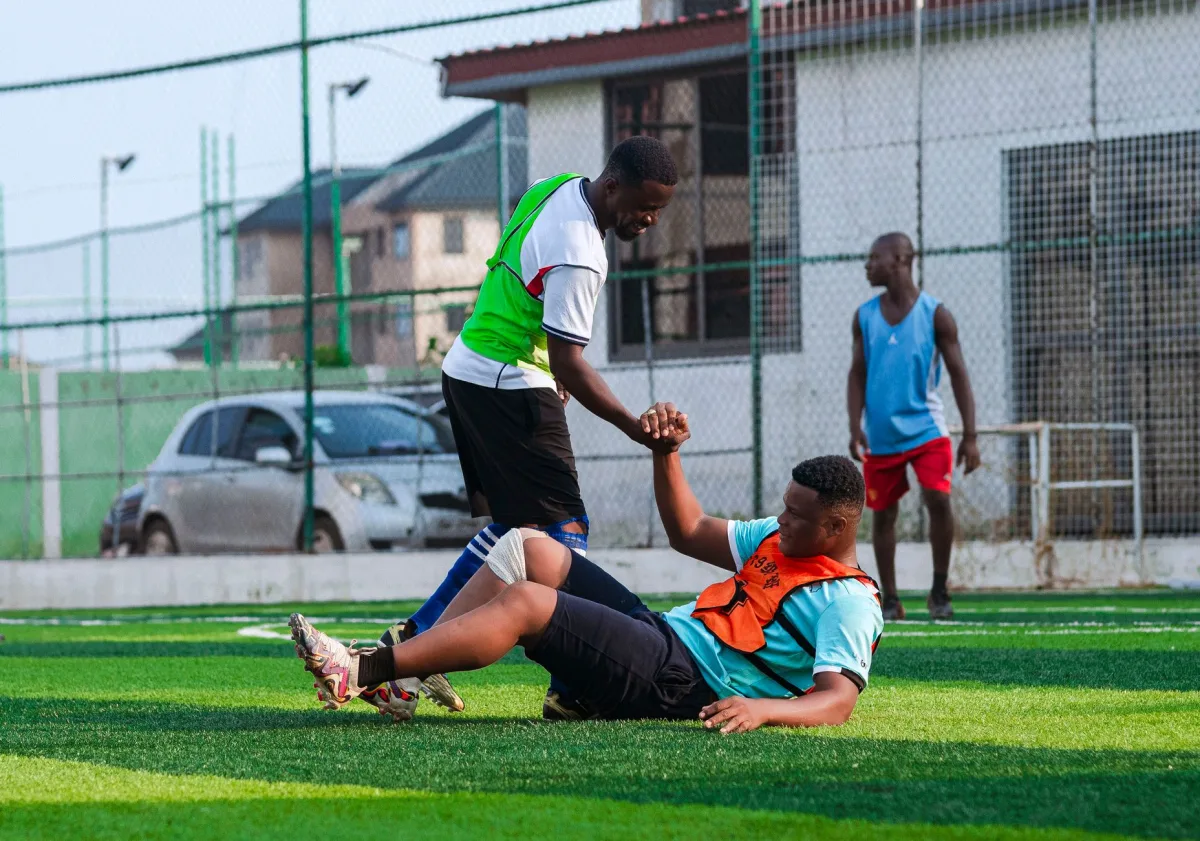Two men playing soccer, showing teamwork and sportsmanship outdoors. Two men playing soccer, showing teamwork and sportsmanship outdoors.