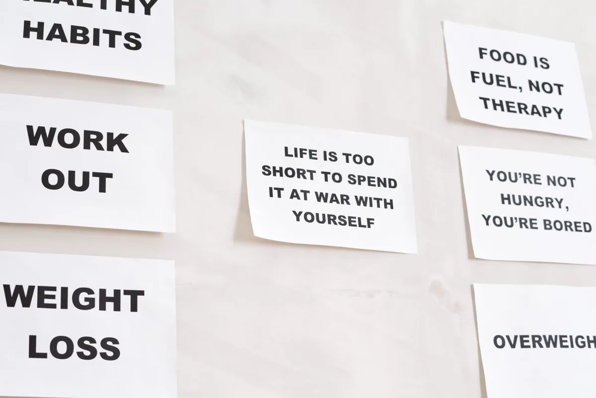 Motivational quotes on white paper promoting healthy habits and lifestyle changes.