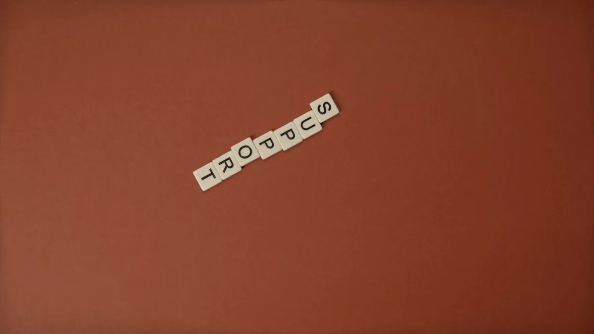 Letter tiles spelling 'Support' on a brown background with ample copy space. Letter tiles spelling 'Support' on a brown background with ample copy space.