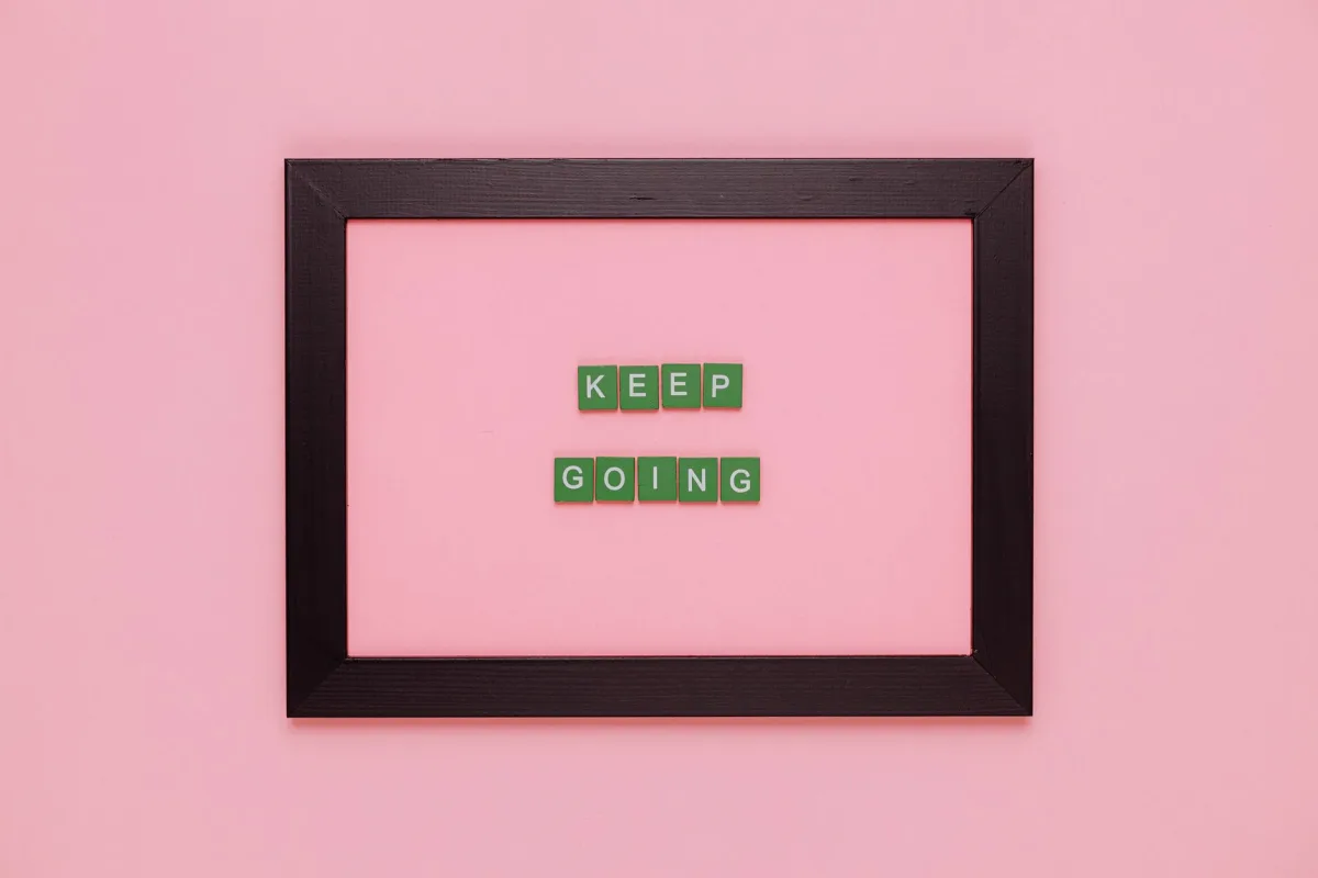A framed motivational quote on a pink background inspiration. A framed motivational quote on a pink background inspiration.
