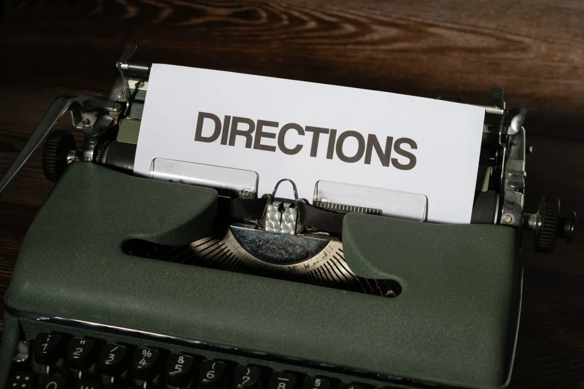 A vintage typewriter displaying the word 'DIRECTIONS' on paper, evoking nostalgia. A vintage typewriter displaying the word 'DIRECTIONS' on paper, evoking nostalgia.