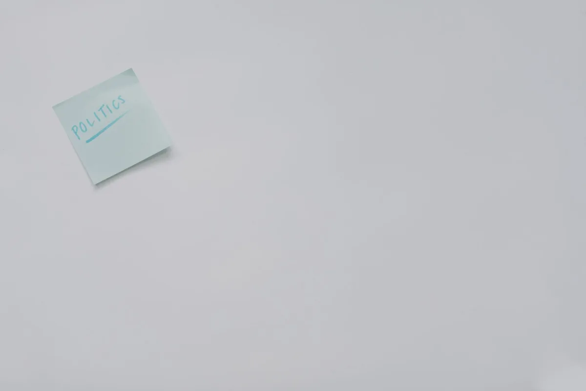 A simple sticky note with 'politics' written on it, offering ample copyspace. A simple sticky note with 'politics' written on it, offering ample copyspace.