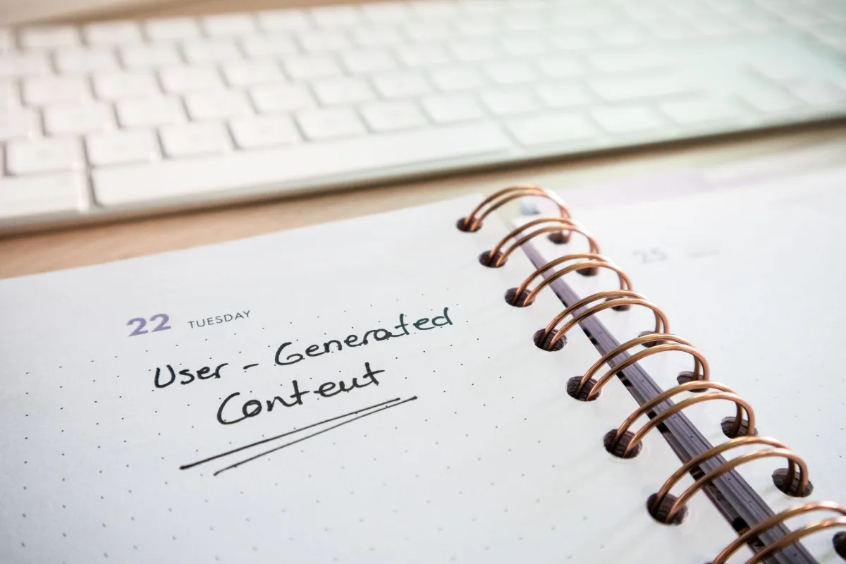 Notebook with user-generated content note and keyboard, ideal planning and productivity. Notebook with user-generated content note and keyboard, ideal planning and productivity.