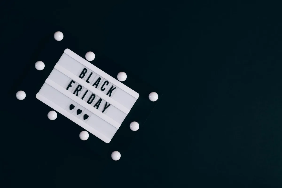 Black Friday sign on dark background with hearts for seasonal promotions. Black Friday sign on dark background with hearts for seasonal promotions.