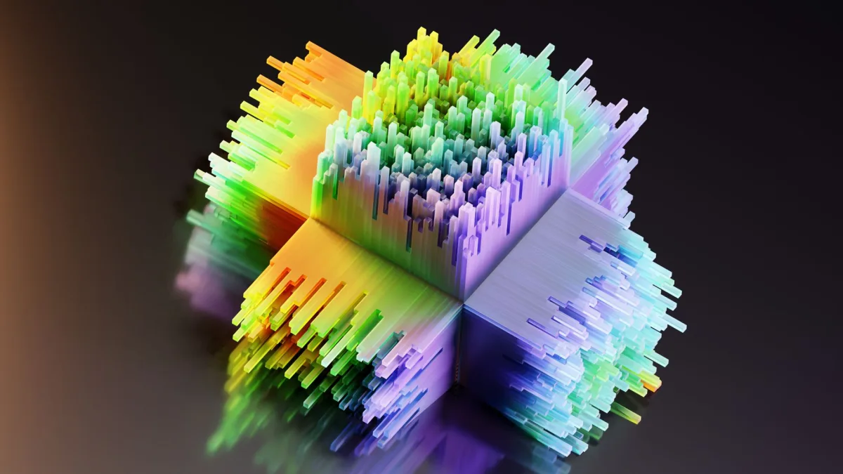 Vibrant geometric 3D shape with rainbow colors on a dark background, showcasing abstract art and design.