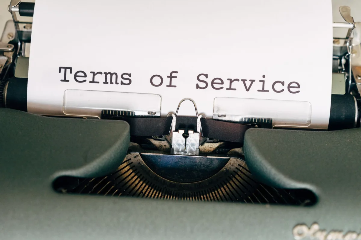 A vintage typewriter with a paper displaying 'Terms of Service'. Perfect for business or legal themes.