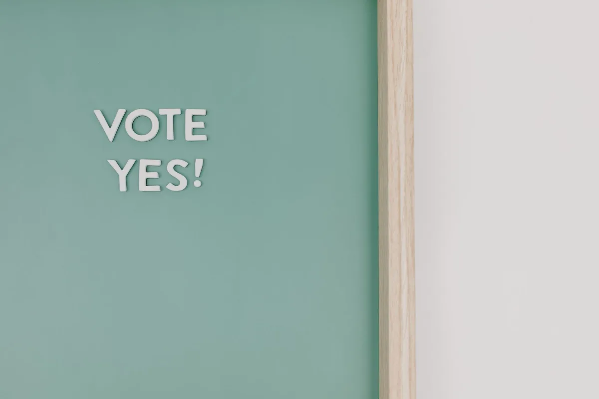 Close-up of a chalkboard with 'Vote Yes!' text, offering copy space. Close-up of a chalkboard with 'Vote Yes!' text, offering copy space.