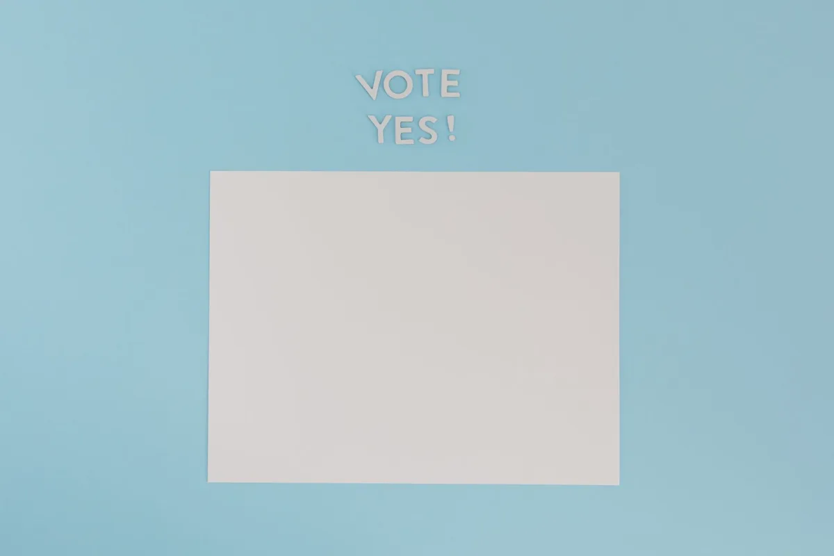 A blank sheet of paper with 'Vote Yes!' text on a blue background, ideal for conceptual designs. A blank sheet of paper with 'Vote Yes!' text on a blue background, ideal for conceptual designs.