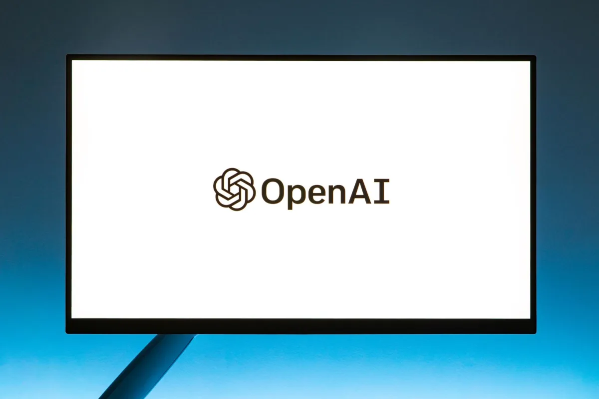 Minimalistic display of OpenAI logo on a monitor with a gradient blue background, representing modern technology. Minimalistic display of OpenAI logo on a monitor with a gradient blue background, representing modern technology.