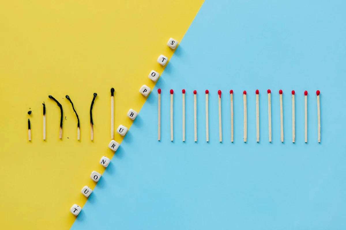 Illustration of burnout concept with burned matches and letter cubes spelling 'Stop Burnout.' Illustration of burnout concept with burned matches and letter cubes spelling 'Stop Burnout.'