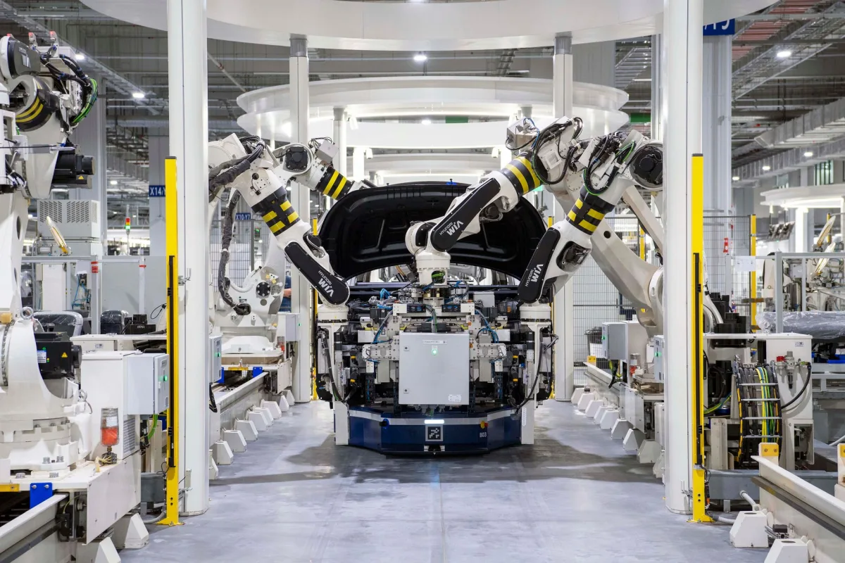 High-tech robots assembling a car a modern factory setting, showcasing