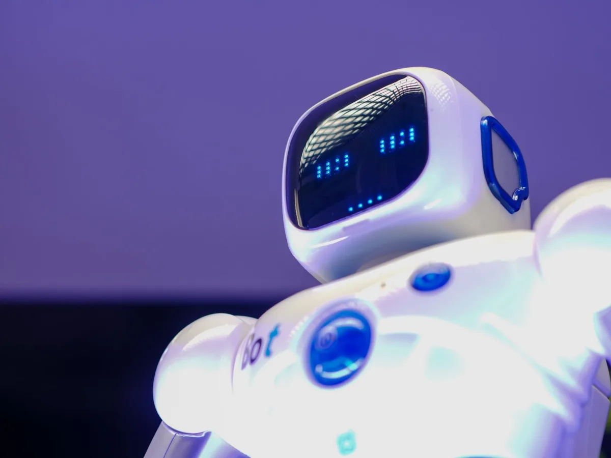 A modern humanoid robot with digital face and luminescent screen, symbolizing innovation technology. A modern humanoid robot with digital face and luminescent screen, symbolizing innovation technology.